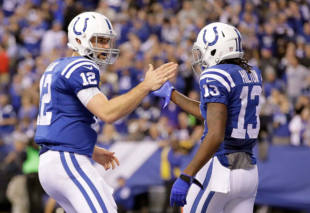 Colts quarterback Andrew Luck high-fives T.Y. Hilton after a play.