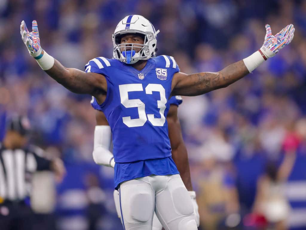 Colts linebacker Darius Leonard puts his arms up before a play in 2019.
