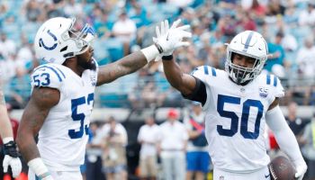 Colts linebackers Darius Leonard high-fives Anthony Walker after a play.