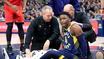Pacers guard Victor Oladipo sits on the floor hurt.