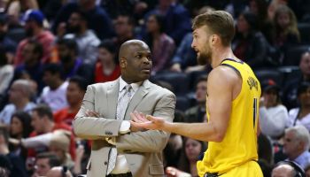 Pacers head coach Nate McMillan talks to Domantas Sabonis during a game.