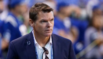 Colts GM Chris Ballard walks on the sideline before a home game.