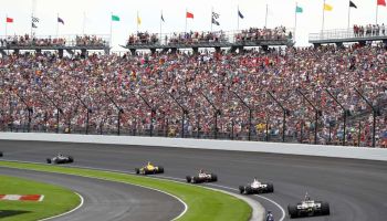 The field takes the turn one after the restart during the 103rd Indianapolis 500 at Indianapolis Motor Speedway on May 26, 2019 in Indianapolis, Indiana
