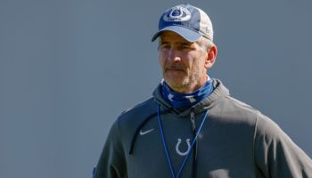 Frank Reich looks on at a training camp practice.