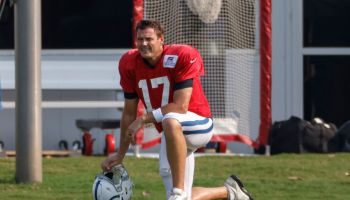 Quarterback Philip Rivers takes a knee during practice.