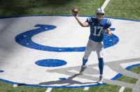 Colts quarterback Philip Rivers throws a pass at Lucas Oil Stadium.