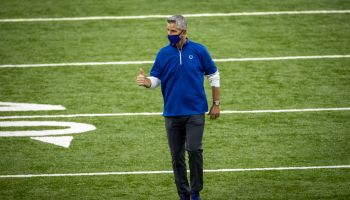 Colts head coach Frank Reich offers a thumbs up walking off the field.