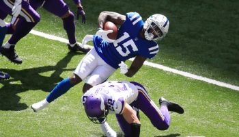 Colts wideout Parris Campbell gets hit by Vikings safety Harrison Smith.