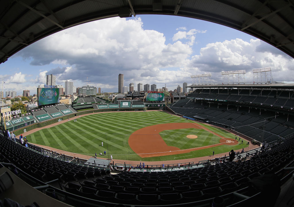 An empty Wrigley Field with cloud coverage above prepares to host Game 1 of the NL Wild Card Series between the Cubs and Marlins
