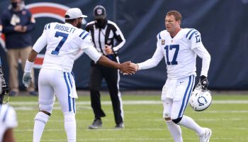 Colts QB-Philip Rivers shakes the hand of Jacoby Brissett after a play.