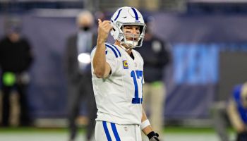 Philip Rivers holds up his right hand to motion to a Colts receiver