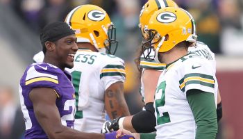 Aaron Rodgers shakes hands with now Colts cornerback Xavier Rhodes when he was with the Vikings