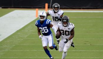 Colts player Rock Ya-Sin chases after Jaguars running back James Robinson.