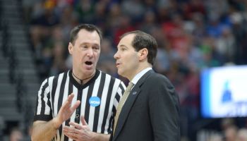 Scott Drew talks to a NCAA referee on the sideline in Baylor's matchup with Gonzaga
