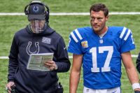 Colts QB-Philip Rivers talks to Frank Reich during a game.
