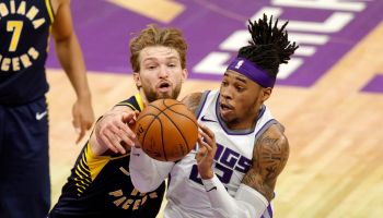 Pacers forward Domantas Sabonis tries to defend a Kings player.