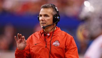 Urban Meyer coaches in the Big Ten Championship at Lucas Oil Stadium with his headset on