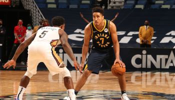 Pacers guard Malcolm Brogdon dribbles out front.