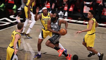 James Harden cuts to the basketball in the middle of three Pacer players Myles Turner, Malcolm Brogdon and Doug McDermott