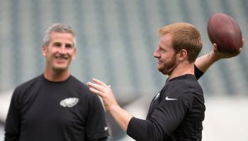 Frank Reich looks on at Carson Wentz.