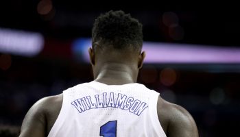 A behind the back shot of Zion Williamson as his #1 Duke jersey is seen