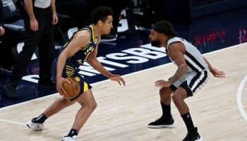 Pacers guard Malcolm Brogdon tries to drive against the Spurs.