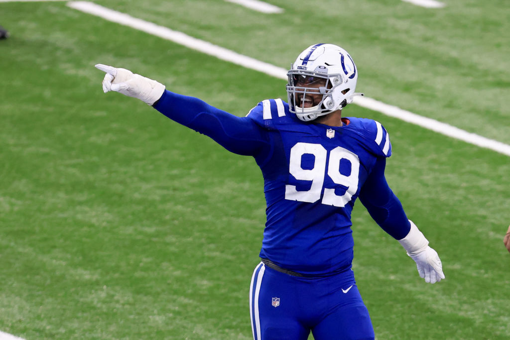 Colts DT-DeForest Buckner points to the crowd in a game.
