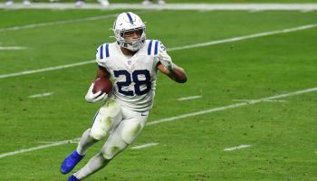 Colts running back Jonathan Taylor runs in a road game.