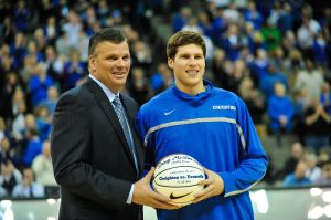 Doug McDermott #3 accepts a ball from his father head coach Greg McDermott of the Creighton Bluejays before the game against the Southern Illinois Salukis at the CenturyLink Center on February 19, 2013 in Omaha, Nebraska.