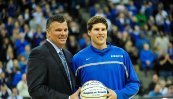 Doug McDermott #3 accepts a ball from his father head coach Greg McDermott of the Creighton Bluejays before the game against the Southern Illinois Salukis at the CenturyLink Center on February 19, 2013 in Omaha, Nebraska.