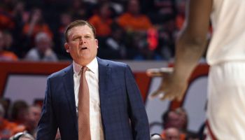 Brad Underwood coaches from the sidelines and speaks to his team in a game for Illinois