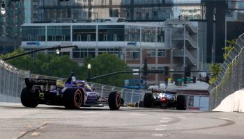 Romain Grosjean makes the turn in Nashville as multiple IndyCars race in front of him