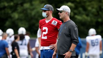 WESTFIELD, INDIANA - AUGUST 12: Head coach Frank Reich and Carson Wentz #2 of the Indianapolis Colts talk on the field during the Carolina Panthers and Indianapolis Colts joint practice at Grand Park on August 12, 2021 in Westfield, Indiana. (Photo by Justin Casterline/Getty Images)