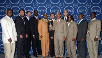 Tony Dungy is surrounded by Jeff Saturday, Peyton Manning, and numerous other former Colts on the carpet at the ESPYs
