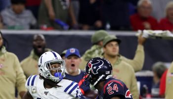 TY Hilton looking for ball past Texans defender trailing him