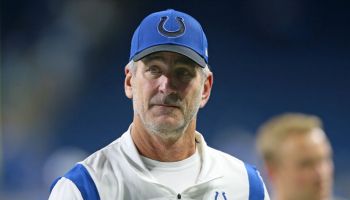 Colts Frank Reich walks down the sideline.