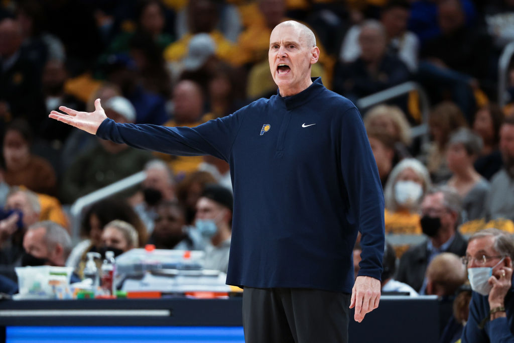 Rick Carlisle on the Pacers sideline shouts in the direction of the floor