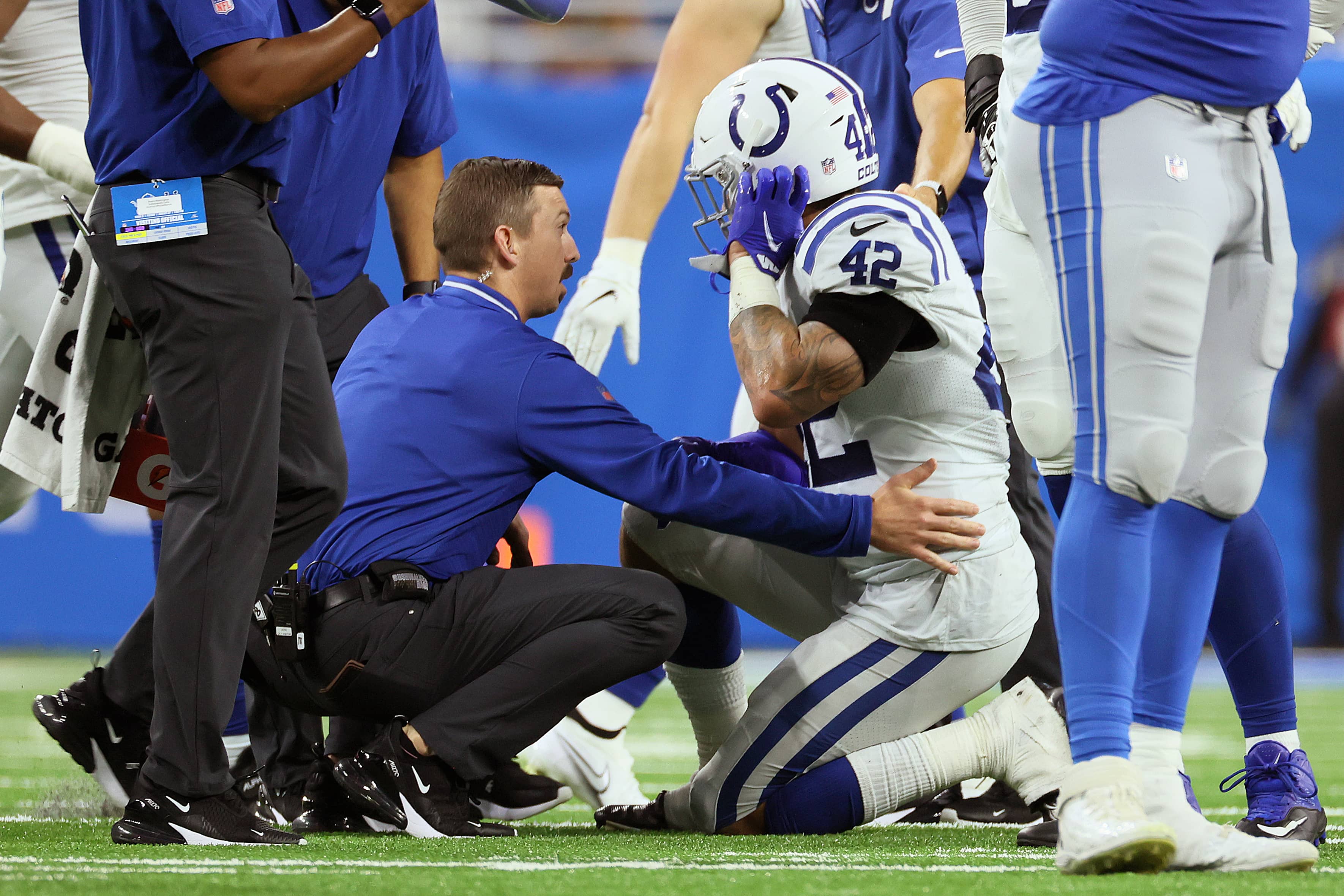 Colts player receiving attention from training staff