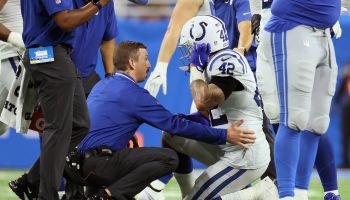 Colts player receiving attention from training staff
