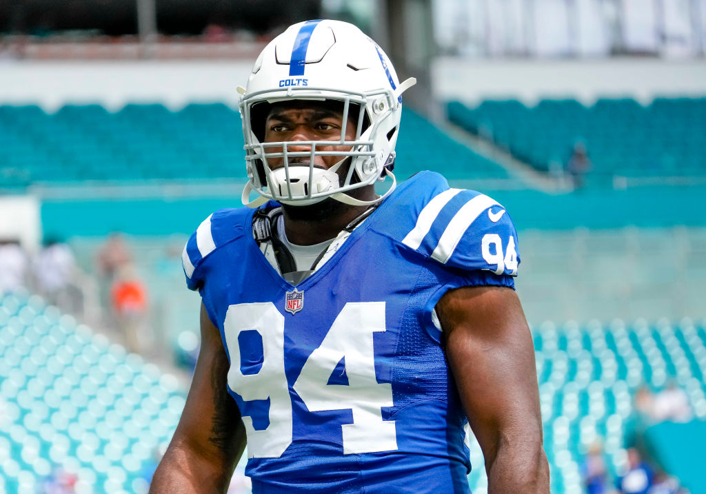 Colts DE-Tyquan Lewis walks on the field before a game.
