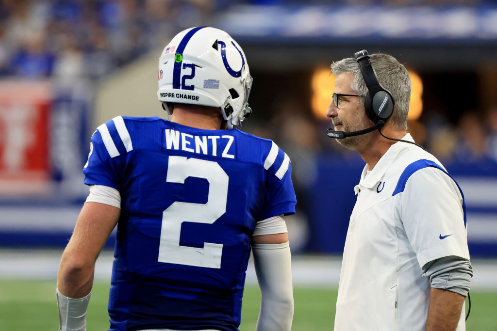 Frank Reich and Carson Wentz talk in a game.
