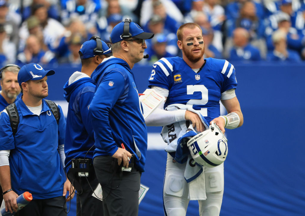 Carson Wentz and Frank Reich talk before a play.