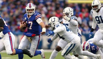 Josh Allen is marauded by a group of Colts defenders on their way to tackle him