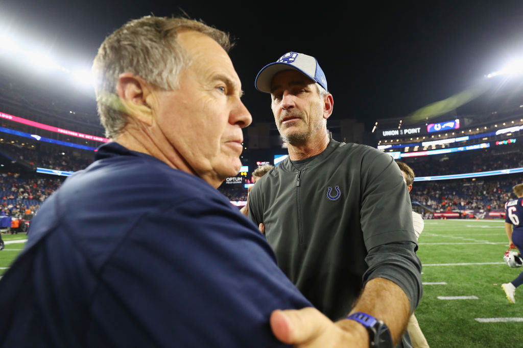 Frank Reich and Bill Belichick talk after a game.