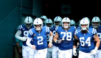 Colts players run out of the tunnel for a game.