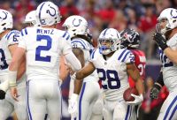 Colts players celebrate after a Jonathan Taylor touchdown.