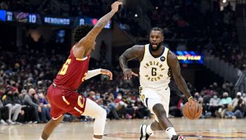 Lance Stephenson dribbles the ball for the Pacers against a Cleveland defender