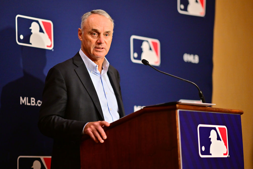 Rob Manfred stands at the podium taking questions from the media