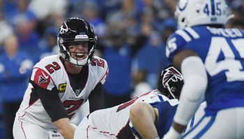 Matt Ryan waits under center for the football as the Colts defense lines up against him