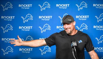 Dan Campbell reacts in a press conference.